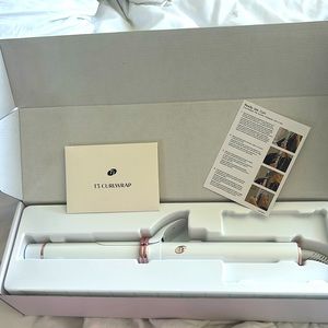 brand new t3 1 1/4 automatic rotating curling iron never touched.